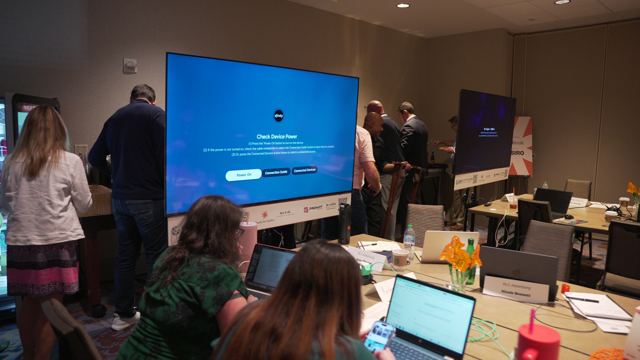 Attendees building at a table